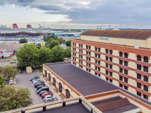 an aerial view of a hotel with a parking lot at Novotel Southampton in Southampton