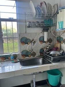 Køkken eller tekøkken på The Blue Cottage + 10 billeder