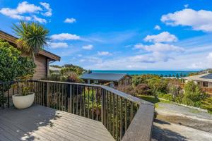 a balcony with a view of the ocean at Ocean Vista Hideaway in Kaikoura