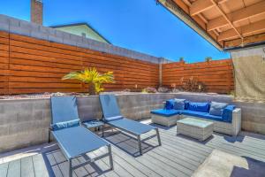 a patio with two chairs and a couch and a table at ᨒོ The Good Life - Fun Pool Escape 15 min to Strip in Las Vegas