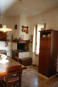 a kitchen with a counter and a table in a room at Ca' Cino in Venice