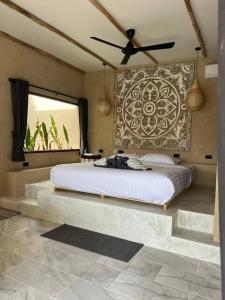 En eller flere senge i et værelse på Villa Timalima Bali pool villa style + 39 billeder