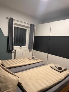 En eller flere senge i et værelse på Apartment Almtal Liebe