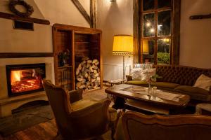 a living room with a couch and a fireplace at Veseud11 in Veseud-Agnita