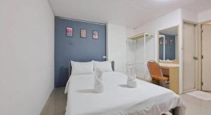 Postel nebo postele na pokoji v ubytování SURANG MANSION + 71 fotografií