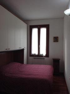Cama o camas de una habitación en Appartamento Paleocapa