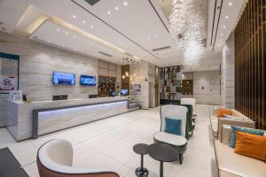 TV a/nebo společenská místnost v ubytování City Comfort Inn Suzhou Wujiang Development Zone Yundong