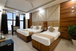 Ένα ή περισσότερα κρεβάτια σε δωμάτιο στο Hotel Krone Aerocity FREE Airport Drop