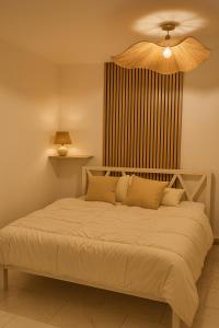 Postel nebo postele na pokoji v ubytování Villa De Alexiano