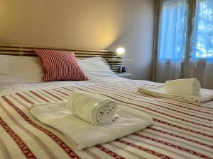 Postel nebo postele na pokoji v ubytování Casa ai Dossi + 2 fotografie