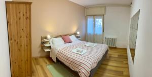 Una cama o camas en una habitación de Casa ai Dossi