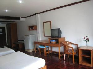 a room with a bed and a desk with a television at Malai - Asia Resort Tabsakae in Ban Nong Kok (2) +42 photos