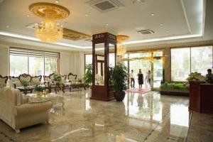 a lobby of a hotel with people walking in it at Bacninh Charming Hotel in Bồ Sơn