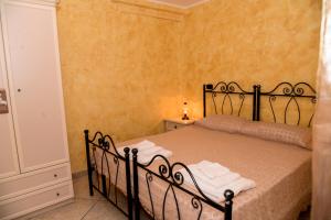 Postel nebo postele na pokoji v ubytování B&B Casa Magaldi