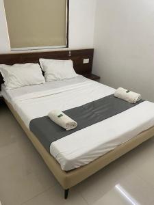 Una cama o camas en una habitación de Namo Guest House