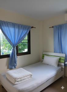 Postel nebo postele na pokoji v ubytování Backpack Bay