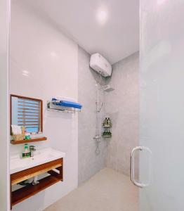a bathroom with a shower and a sink at Mie's Homestay in Danang +73 photos