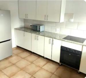 Kuchyň nebo kuchyňský kout v ubytování Pebble urban charm