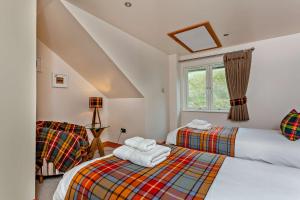 Ένα ή περισσότερα κρεβάτια σε δωμάτιο στο Sealladh an Loch