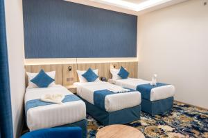 En eller flere senge i et værelse på فندق برادايس لاند الشهداء