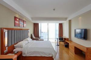 TV a/nebo společenská místnost v ubytování Warmly Hotel Suzhou Shuanghuwan