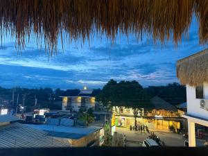 a view of a town at night at Isa- Hostel in Panglao Island