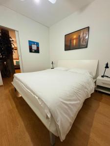 Postel nebo postele na pokoji v ubytování Windshouse Apartments