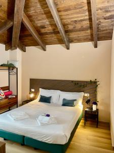 Postel nebo postele na pokoji v ubytování Bnbook Residence Matteotti