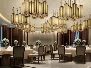 Un restaurante u otro lugar para comer en Jiyuan Oriental Jianguo Hotel