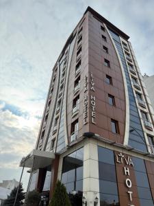 a tall building with the words hotel waikiki at My Liva Hotel in Kayseri