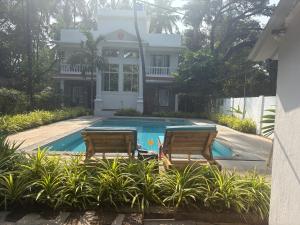 Bazén v ubytování Nature's Inn Luxury Villa Morjim Goa, 4bhk and Sparkling Pool nebo v jeho okolí + 23 fotografií