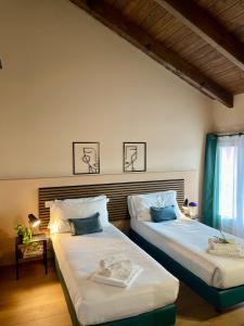 Postel nebo postele na pokoji v ubytování Bnbook Residence Matteotti