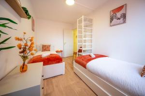 Giường trong phòng chung tại Le Cocon Terracotta