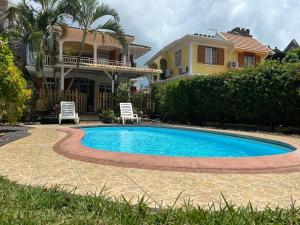 Бассейн в Sun Palm Villa - Blue Bay или поблизости