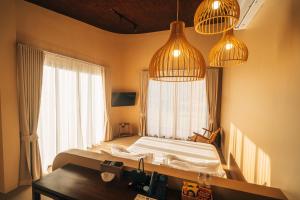 Giường trong phòng chung tại The Fam Cafe&Resort Chiangdao