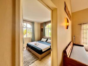 a bedroom with a bed and a window at Bazaar Square Lodges in Grand-Baie +122 photos