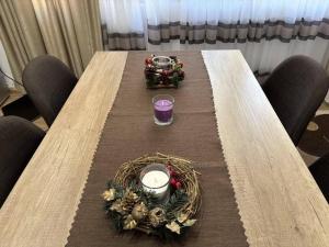 a long wooden table with a tablengthngthngthngthngthngthngthngthngth at Апартамент за гости 4а26 Планинска Магия Grand Monastery Пампорово in Pamporovo +40 photos