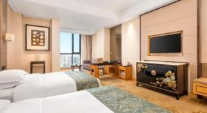 Μια τηλεόραση ή/και κέντρο ψυχαγωγίας στο Jin Jiang Mingcheng Hotel