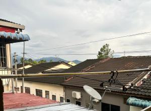 a satellite dish on the roof of a building at Little Stay Inn in Taiping