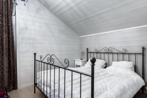 En eller flere senge i et værelse på Fjellspa med Fanstastisk utsikt og Høy standard