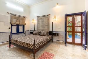 a bedroom with a bed in a room at Gopagiri A unit of Anandmai Homestay in Gwalior +64 photos