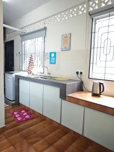 Η κουζίνα ή μικρή κουζίνα στο Desa11 Homestay