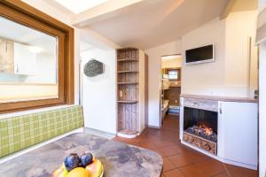 TV a/nebo společenská místnost v ubytování Chalets - Camping Brunner am See