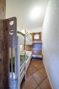 Postel nebo postele na pokoji v ubytování Chalets - Camping Brunner am See