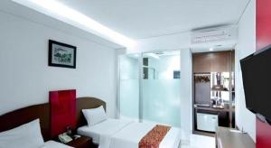 Μια τηλεόραση ή/και κέντρο ψυχαγωγίας στο Kenari Asri Hotel