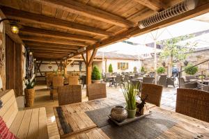 an outdoor patio with a table and chairs at Meiser Altstadt Hotel in Dinkelsbühl