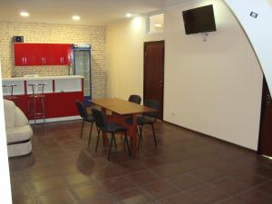a dining room with a table and chairs at Hostel Sofia in Zhytomyr