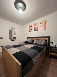 Postel nebo postele na pokoji v ubytování Appartamento Marilleva 1400