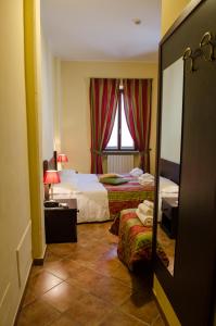 Postel nebo postele na pokoji v ubytování Hotel Oberje Dla Viere