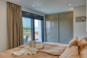 Ένα ή περισσότερα κρεβάτια σε δωμάτιο στο Penélope Beachfront Villa +60 φωτογραφίες